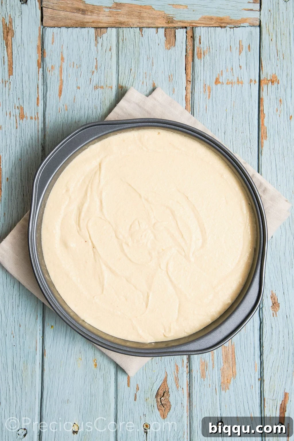 cake batter for the almond and pear cake in a cake pan.