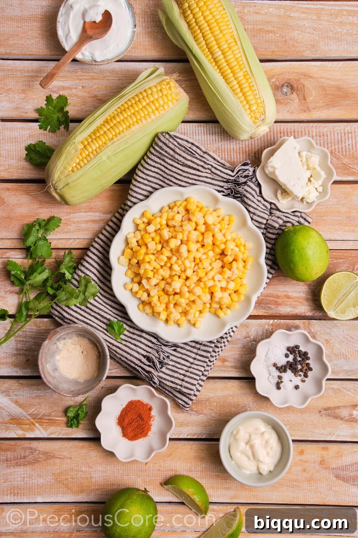 All the fresh ingredients laid out for making a delicious street corn casserole.