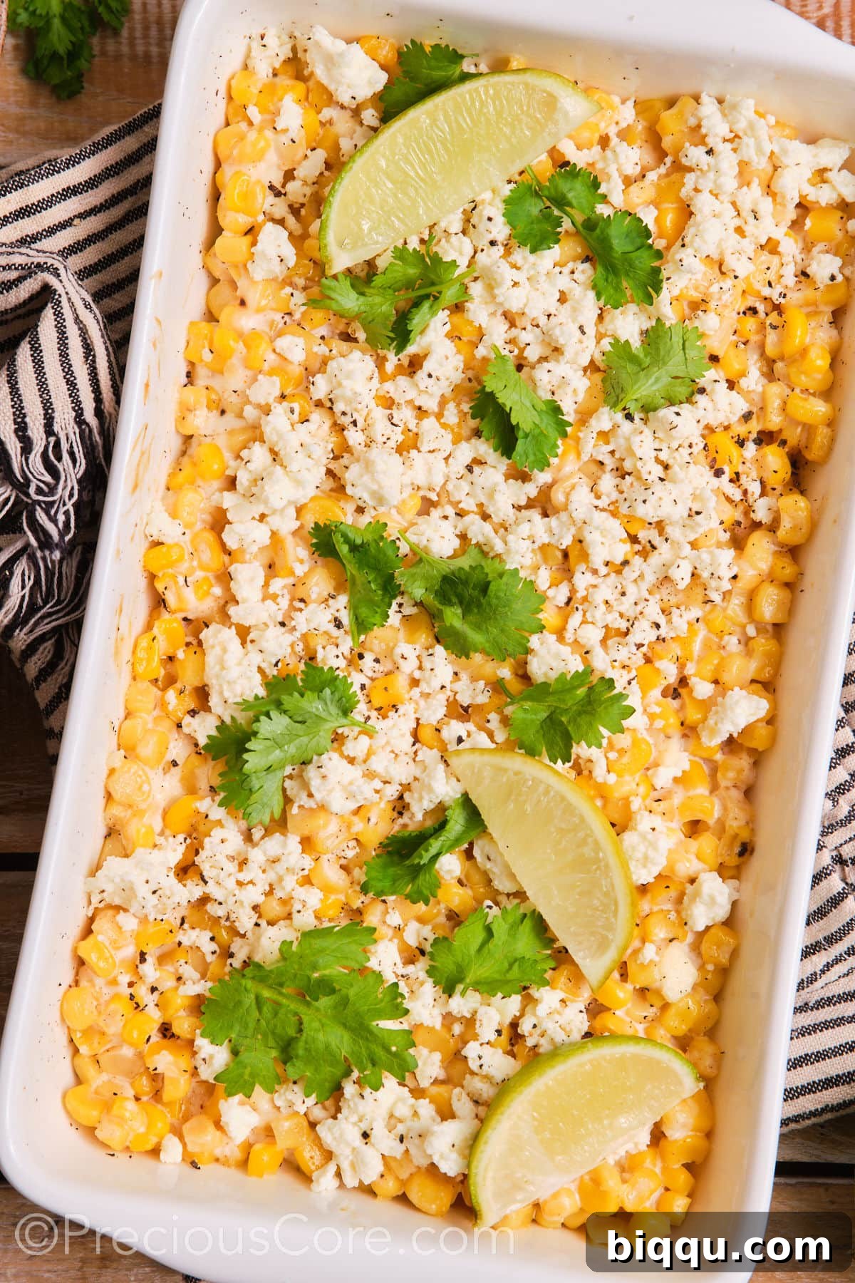 Mexican street corn casserole presented in a elegant white baking dish, ready to be enjoyed.