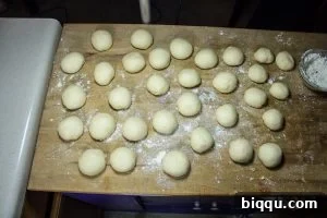 Dough being shaped into balls