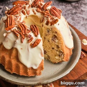 Butter pecan pound cake with a slice taken out, showcasing the recipe.