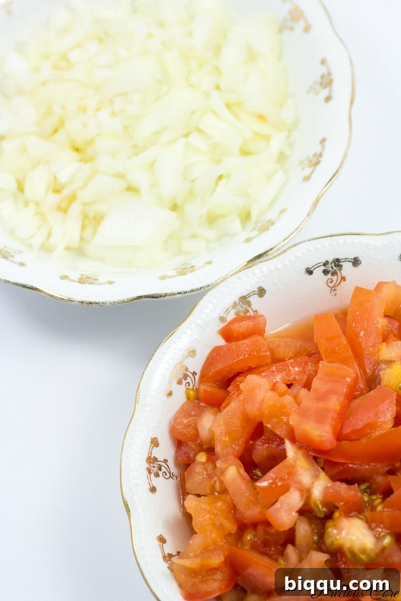 Freshly chopped tomatoes and onions for African Stewed Spinach