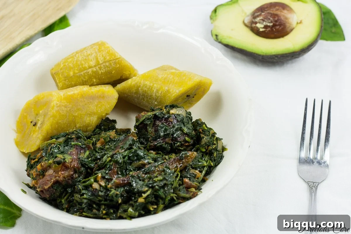 African Stewed Spinach served beautifully with boiled plantains