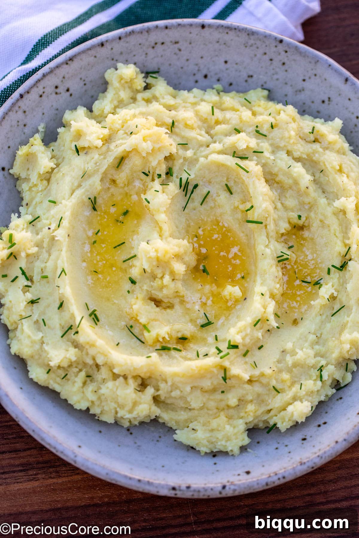 A beautifully presented bowl of creamy mashed white sweet potatoes, ready to be served.