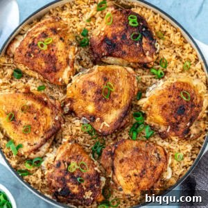 A vibrant image of the finished One Pot Chicken Thighs and Rice dish.