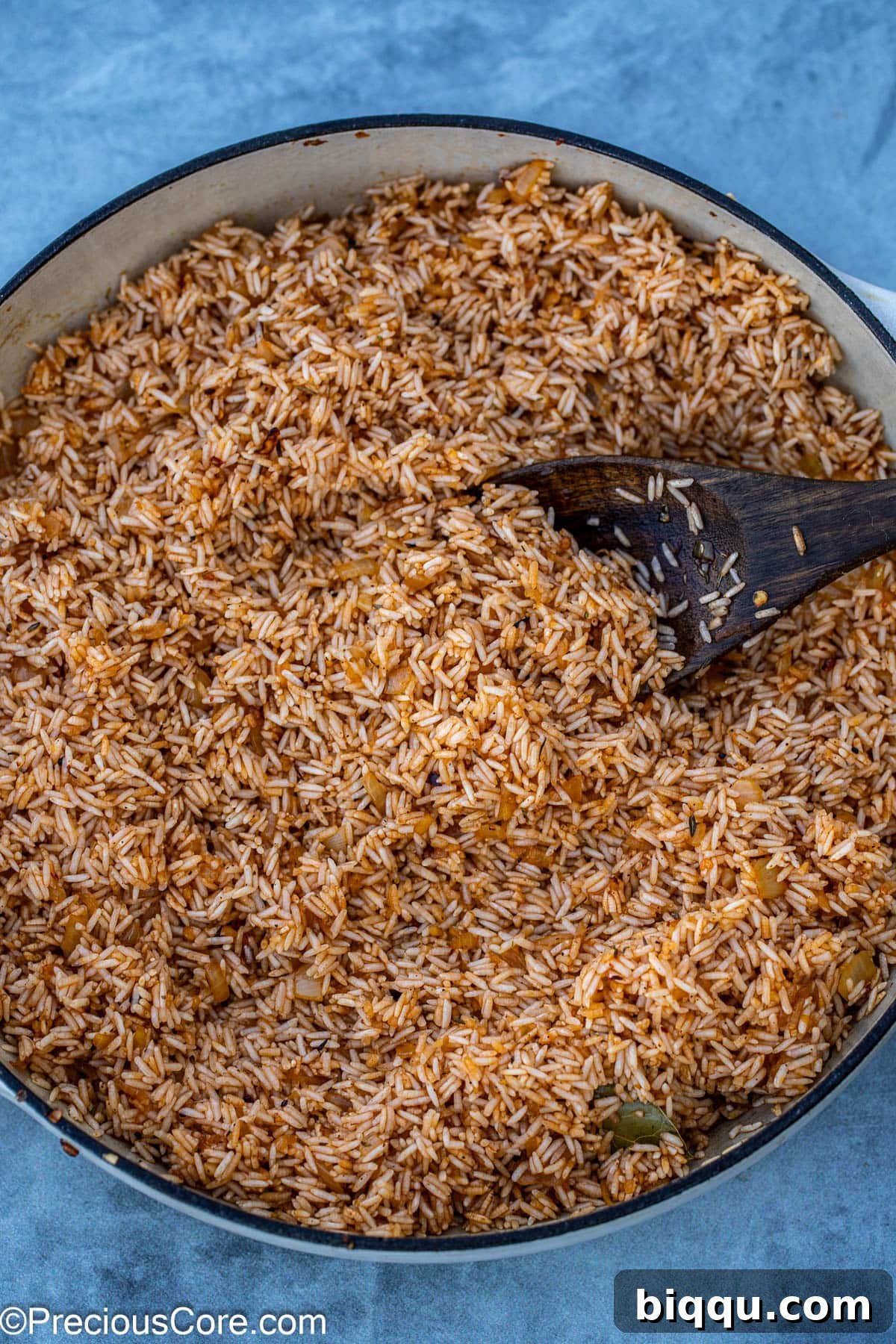 Rinsed Jasmine rice being sautéed with the aromatics in the pot, getting perfectly toasted.