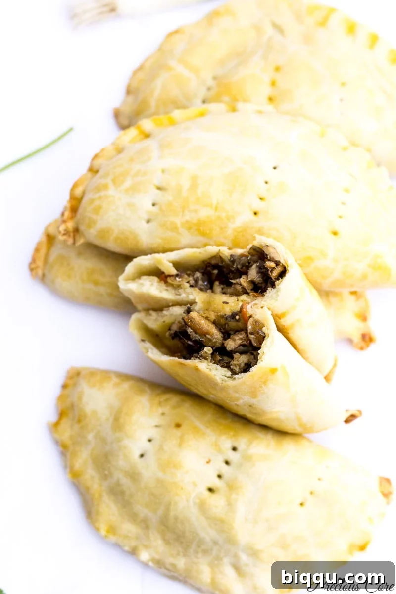A plate of freshly baked Cameroonian Fish Pies, highlighting their golden crust and savory appeal.