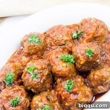 White dish of meatballs in tomato sauce - West African style.