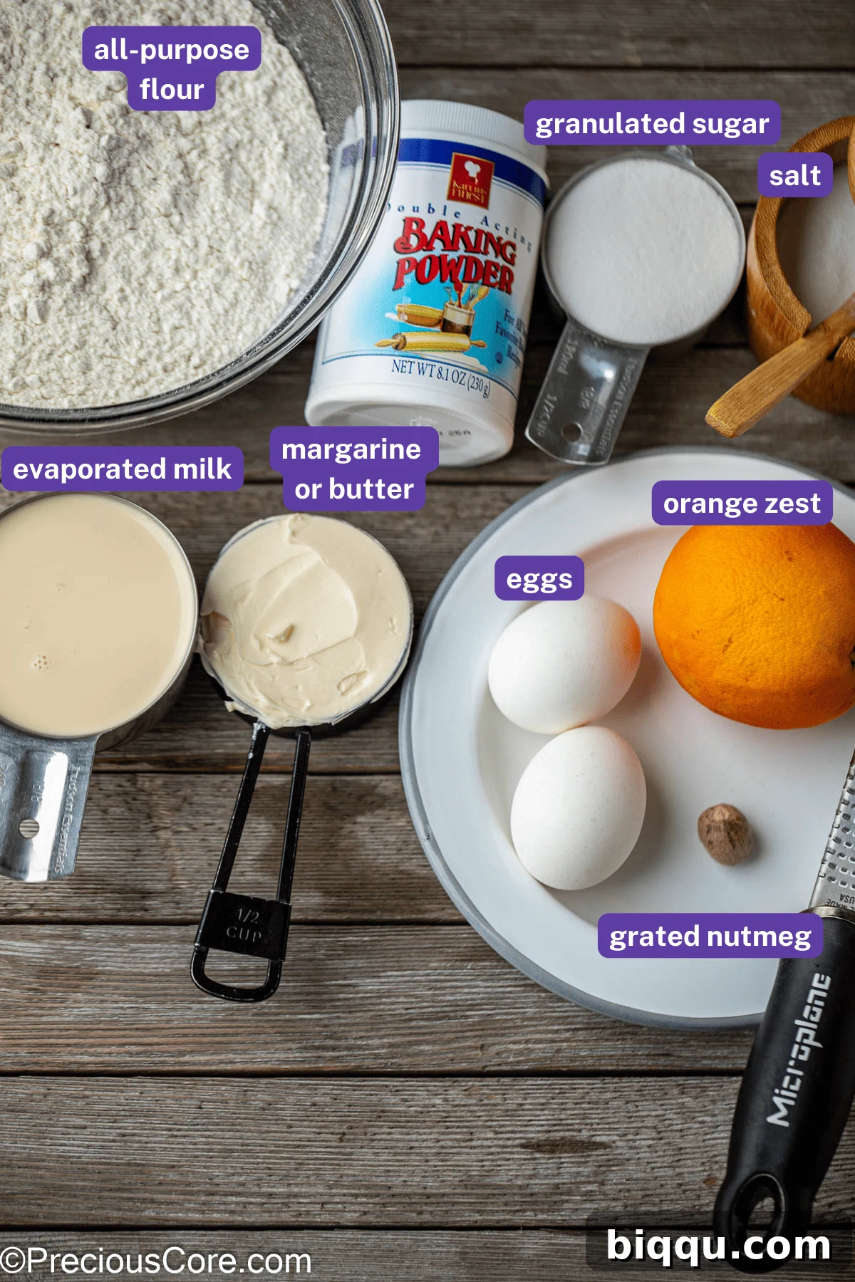 Various Chin Chin ingredients laid out neatly on a kitchen counter: flour, sugar, butter, eggs, milk, nutmeg, and orange zest, highlighting their freshness.