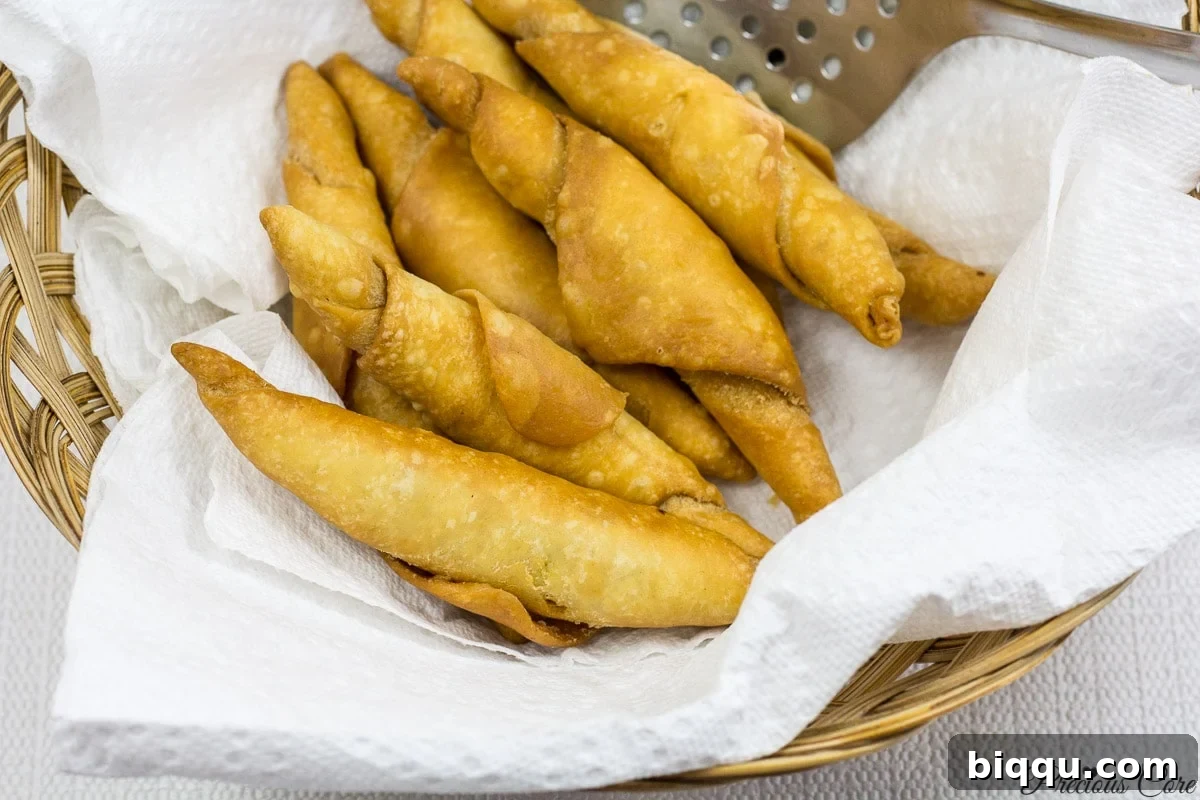 Plated crispy Cameroonian fish rolls, freshly fried and ready for enjoyment