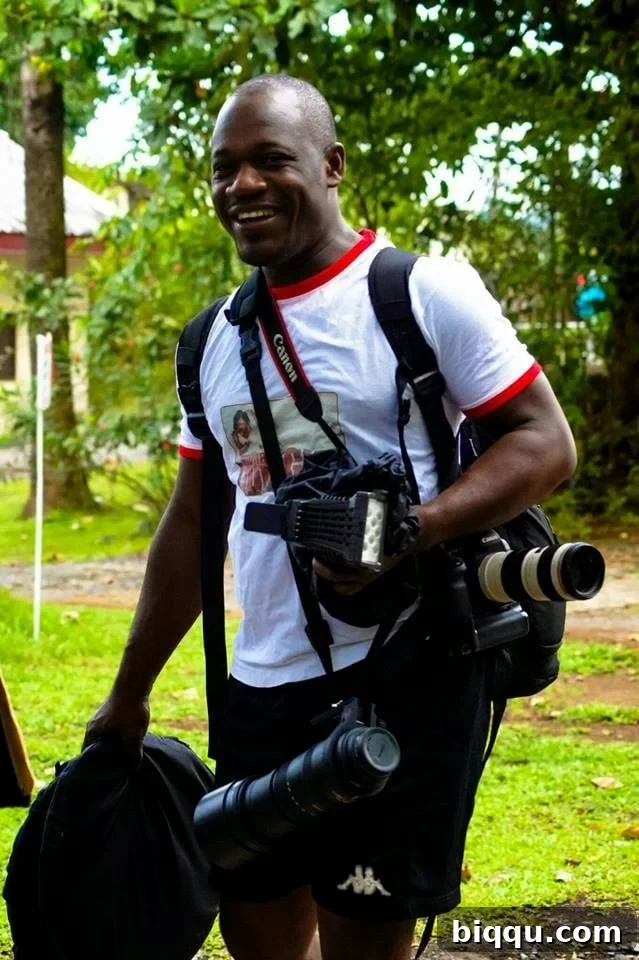 Penjo Baba, a celebrated Cameroonian photographer, captured in a thoughtful pose.