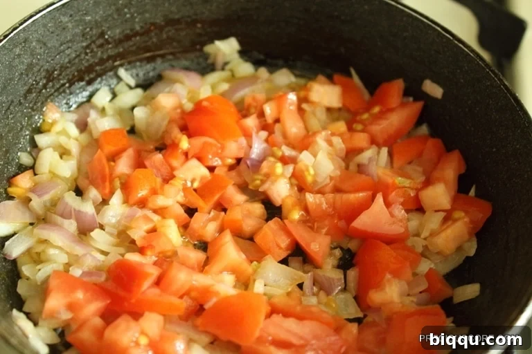 Adding Tomatoes to Skillet