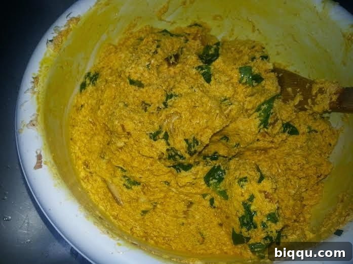 Mixture after palm oil is fully incorporated, showing vibrant color.