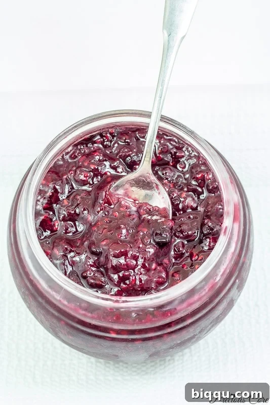 A beautifully set jar of mixed berry jam, perfect for sharing or enjoying solo.