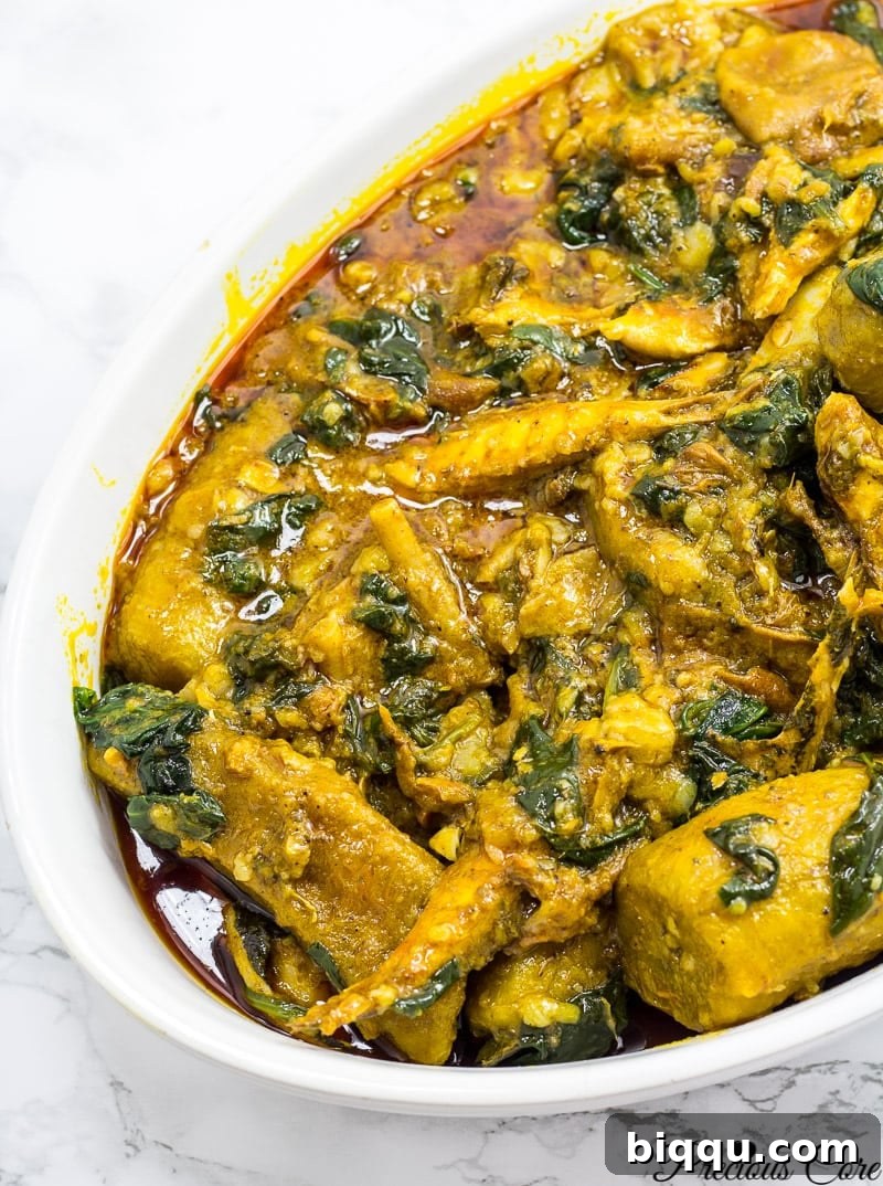Hearty African Plantain Porridge, rich with palm oil and savory ingredients.