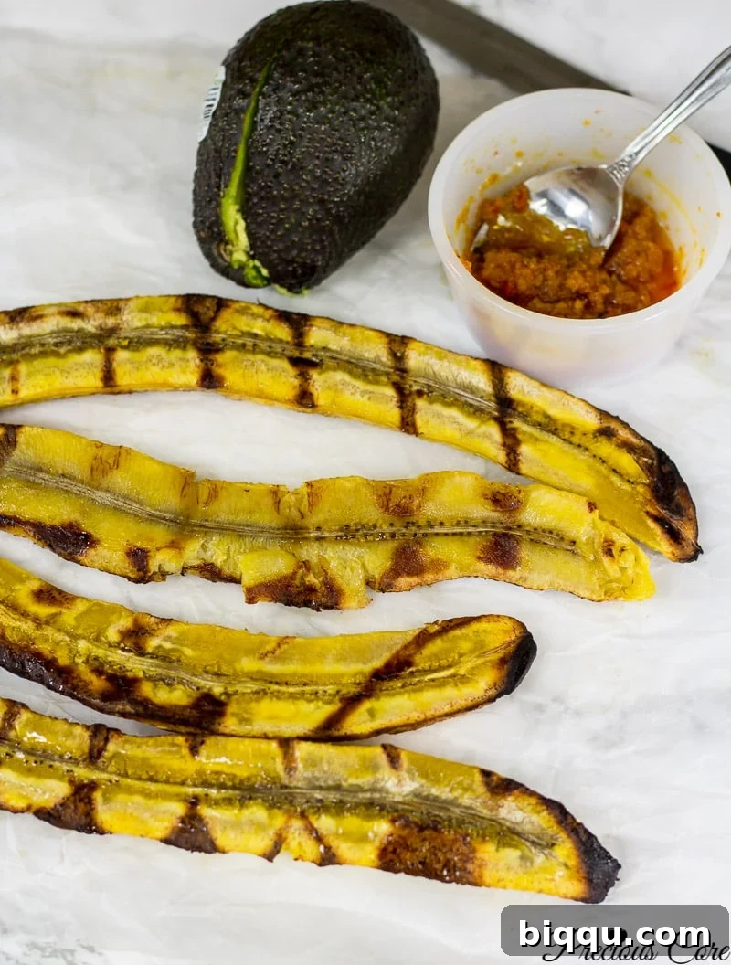 Halved plantains with beautiful grill marks, ready to be enjoyed.