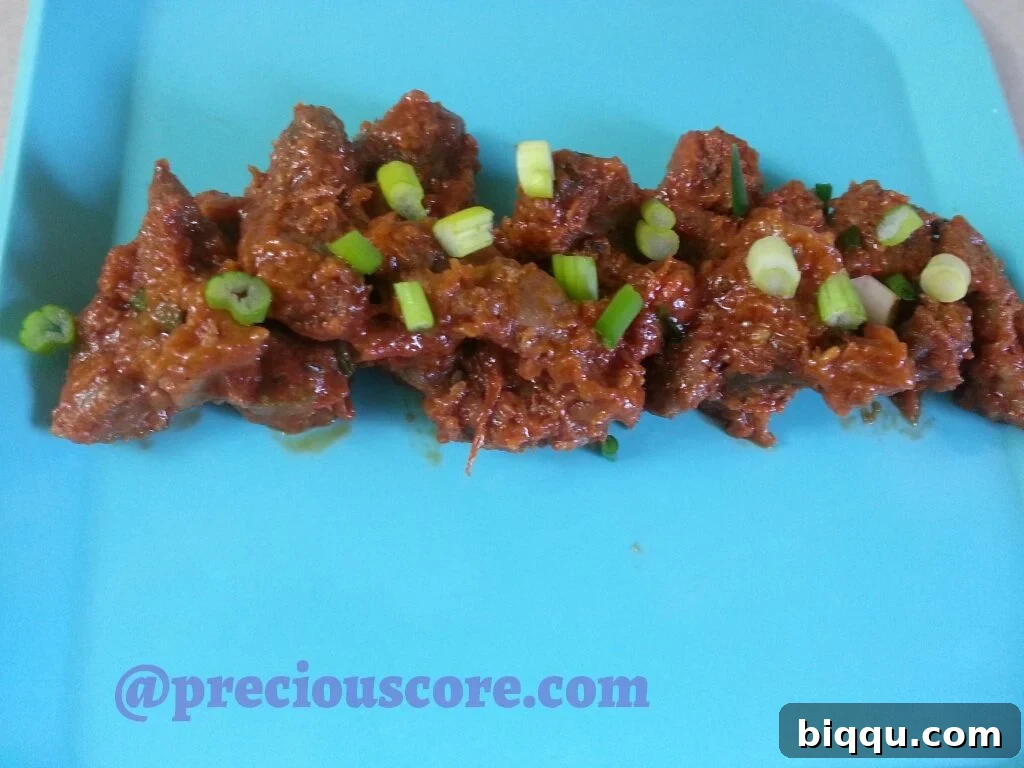 Savory peppered chicken gizzards stewed with tomatoes and spices.