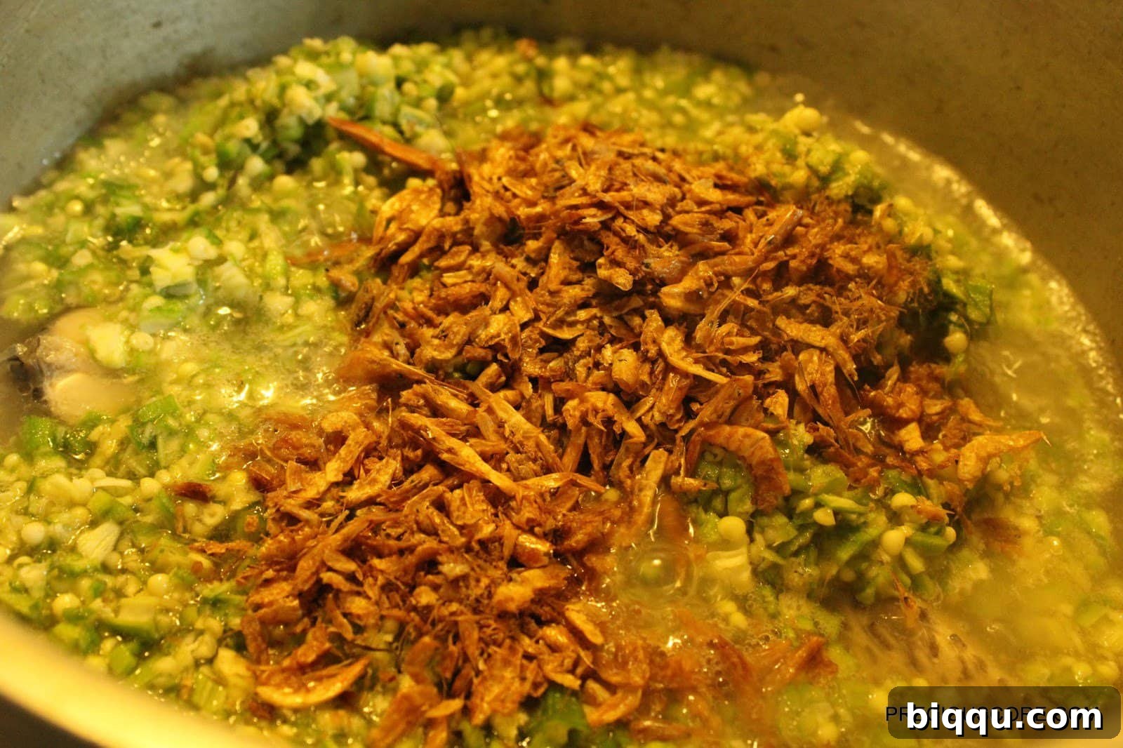 Adding Okra and Spices to Soup