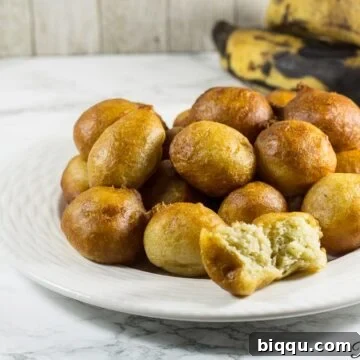 Plantain puff puffs on a white plate.
