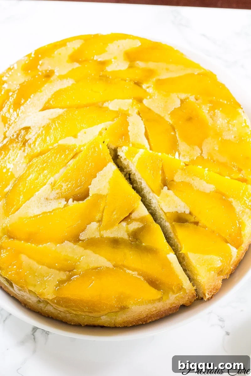 Finished mango upside down cake on a serving plate