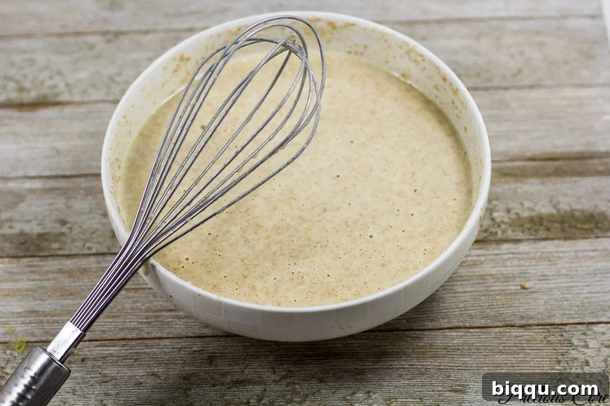 Banana crepes batter mixed in a bowl, ready for cooking.