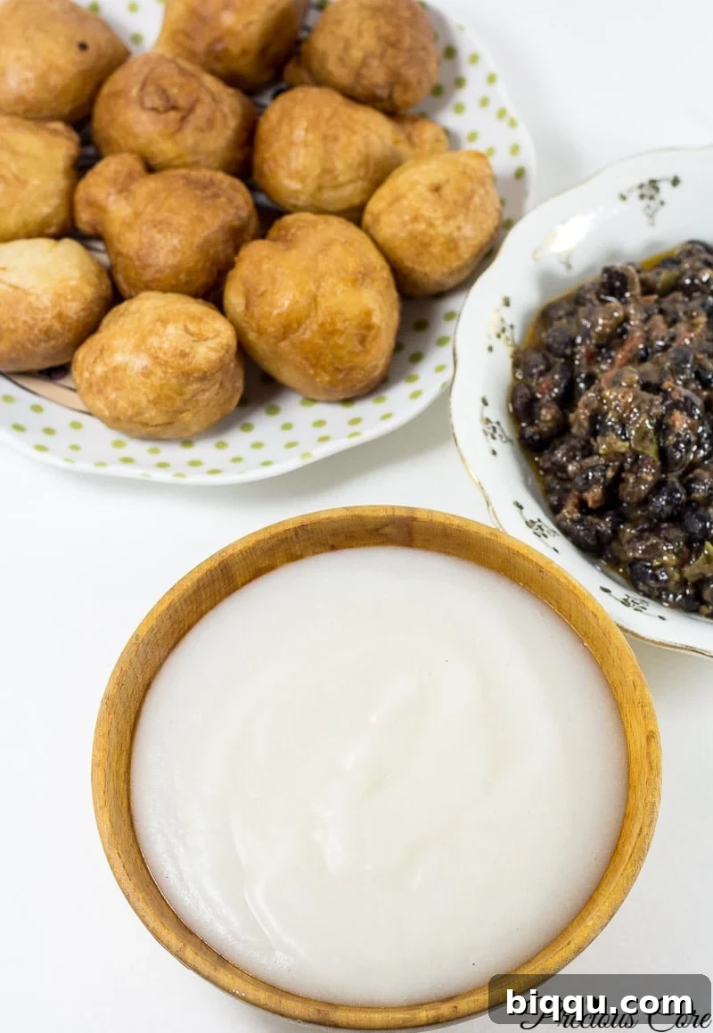 How to make pap from scratch! Pap is a corn porridge typically eaten in Cameroon and Nigeria. Instead of using whole corn as is traditionally used, I used corn flour in this recipe and the results are epic. It is authentic, slightly tangy and so comforting. I love having this for breakfast or a quick dinner.