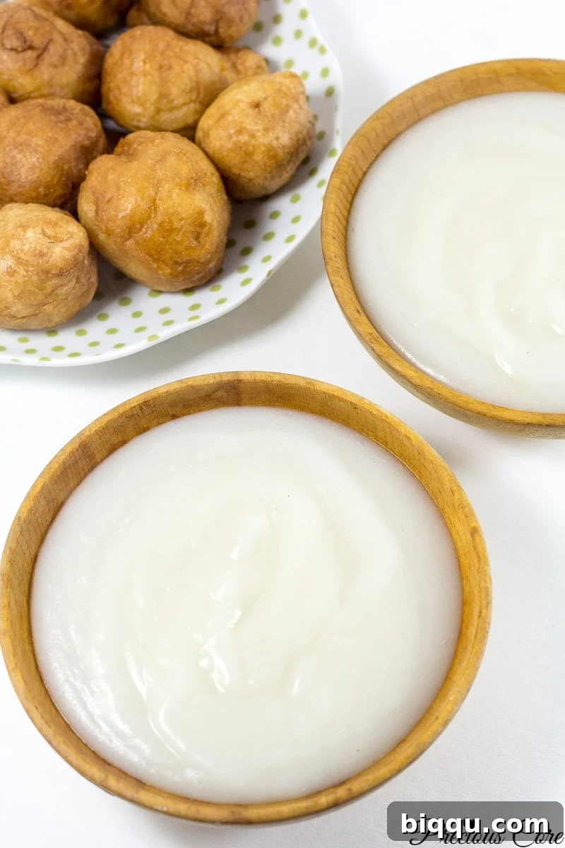 How to make pap from scratch! Pap is a corn porridge typically eaten in Cameroon and Nigeria. Instead of using whole corn as is traditionally used, I used corn flour in this recipe and the results are epic. It is authentic, slightly tangy and so comforting. I love having this for breakfast or a quick dinner.