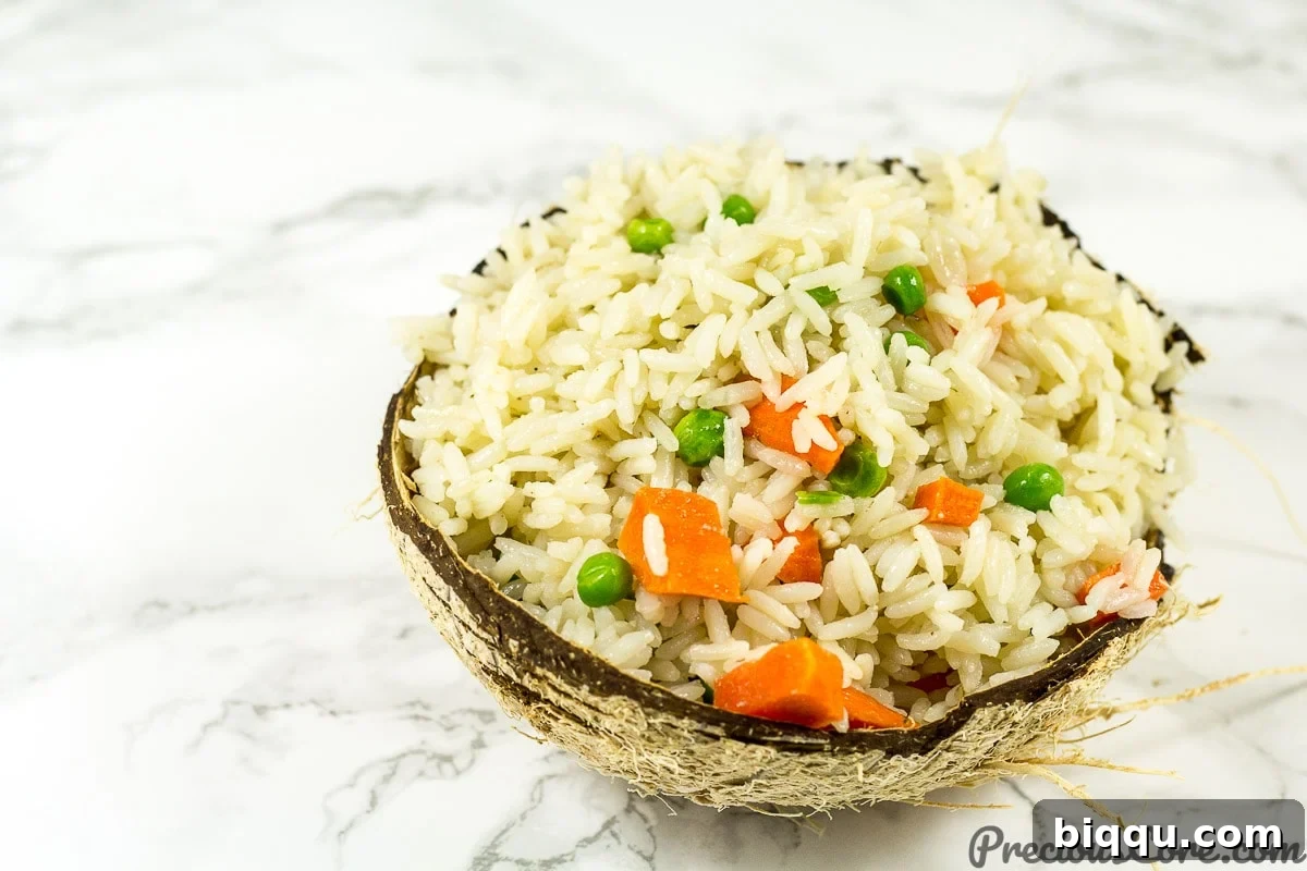 Effortless Coconut Rice 5 Rice cooked in coconut milk with carrots and peas