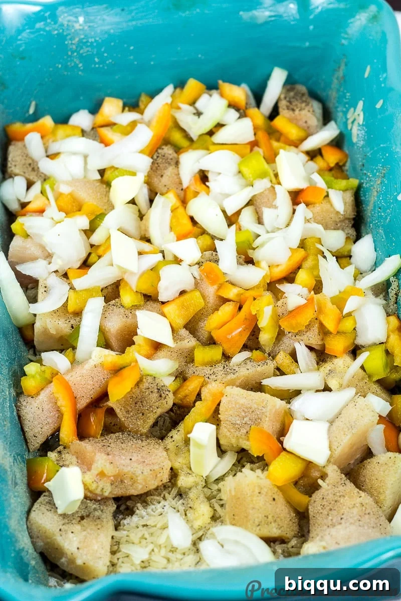 Baked Chicken and Rice Casserole recipe step 1: combining all fresh ingredients in a baking dish