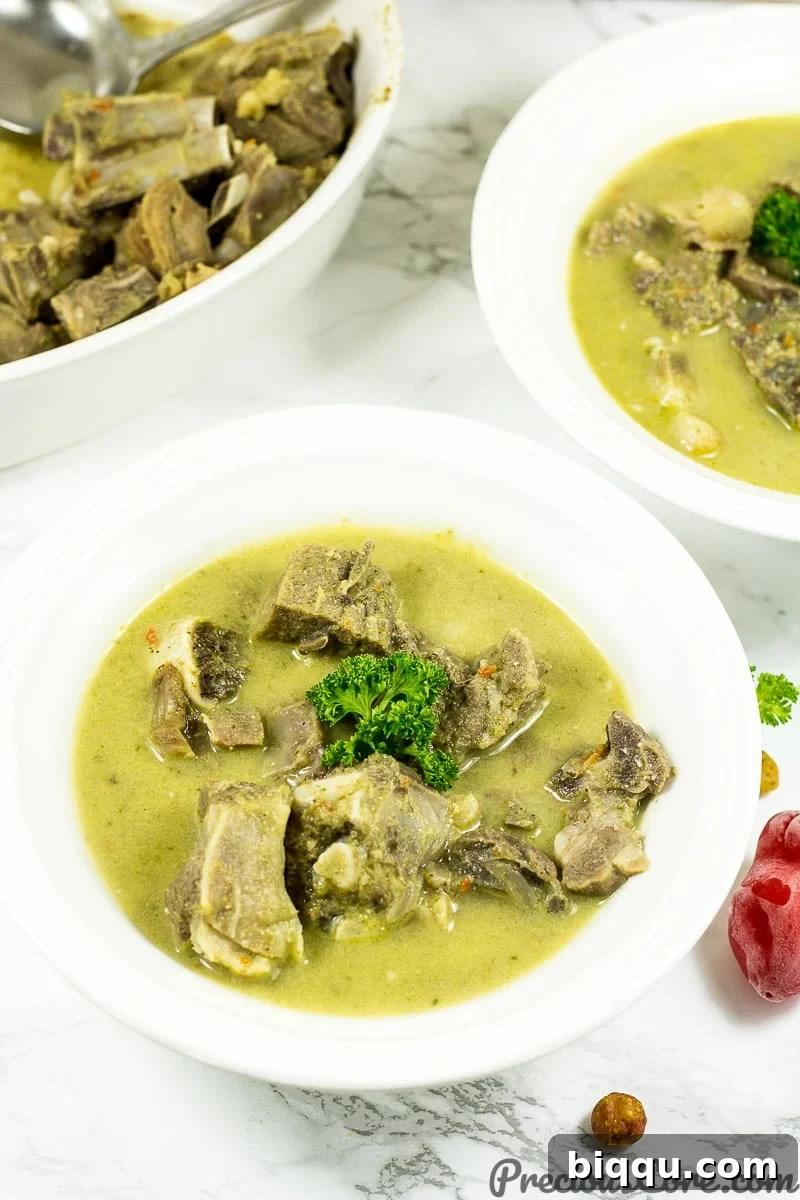 Cameroonian Goat Meat Pepper Soup Recipe, showcasing the rich broth and spices.