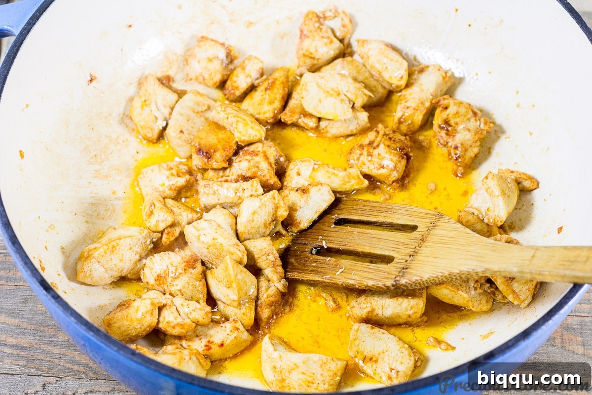 Macaroni and Chicken dinner recipe step 2: cooking seasoned chicken in a pot