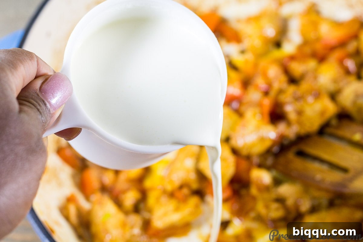 Macaroni and Chicken dinner recipe step 4: adding cream to the chicken and vegetable mixture