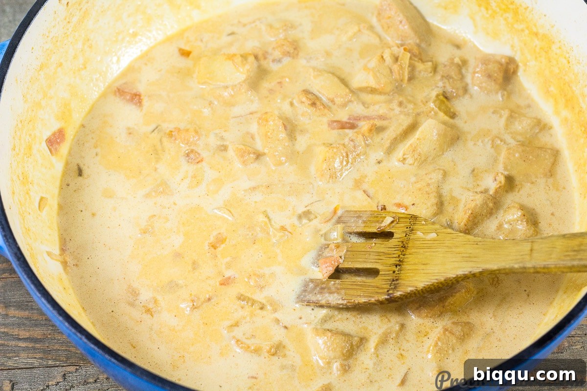 Macaroni and Chicken dinner recipe step 5: adding pasta water and seasonings to the sauce