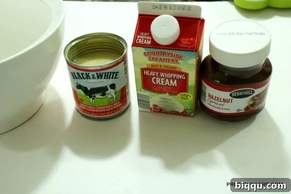 Three essential ingredients: heavy whipping cream, sweetened condensed milk, and chocolate spread