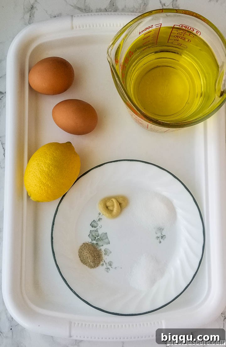 Ingredients for mayonnaise on a tray.