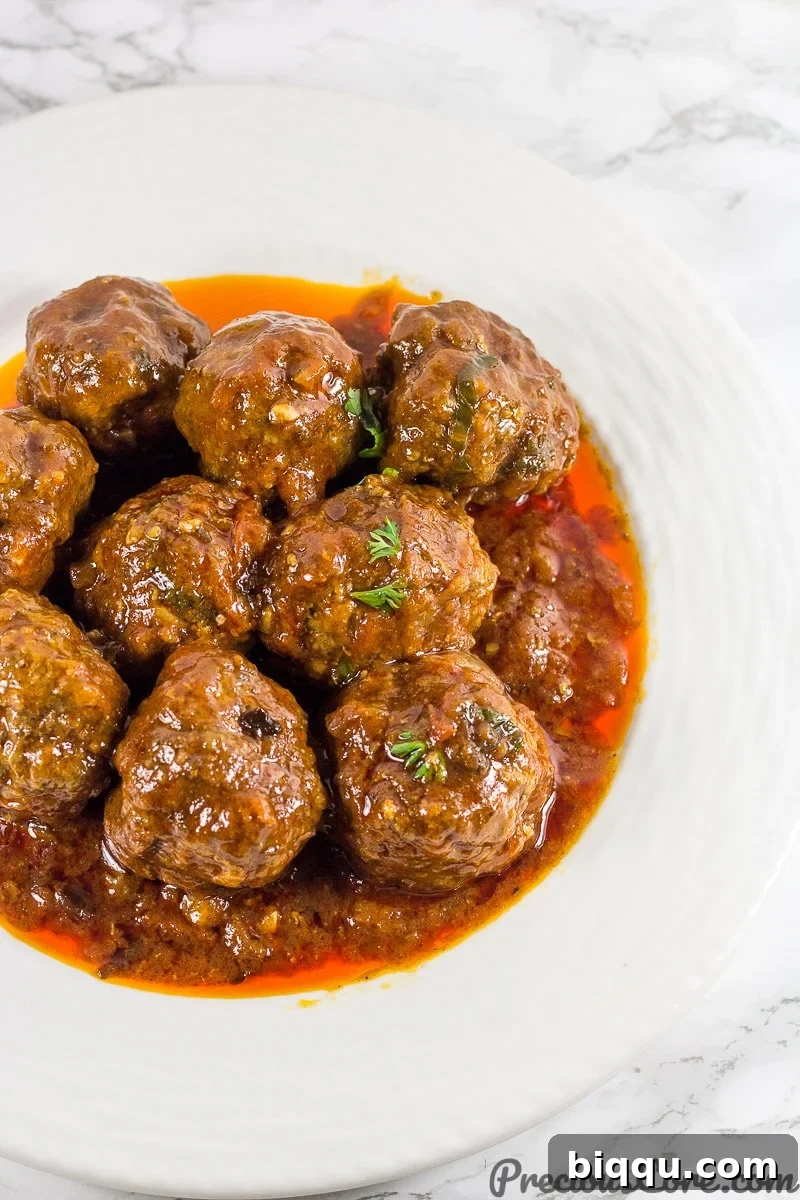 African Meatballs in a rich tomato sauce, served as a delightful African dinner.