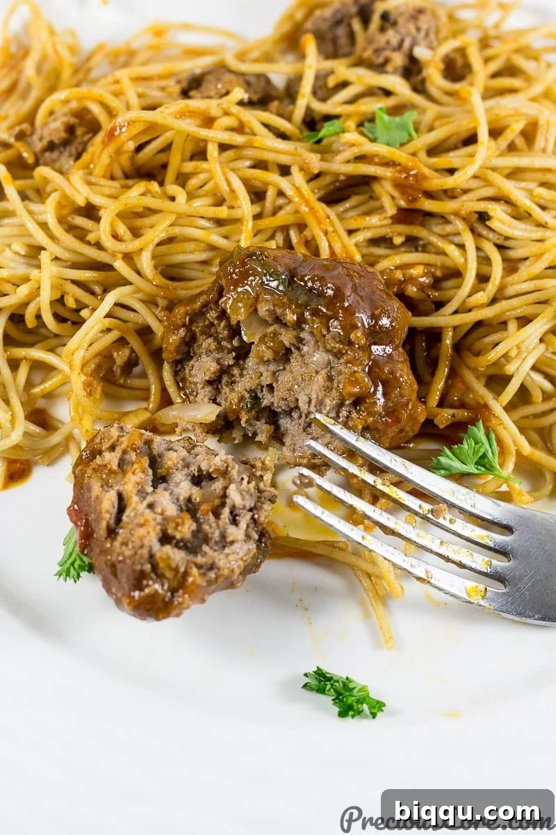 African meatballs served alongside spaghetti, creating a delicious and hearty meal.