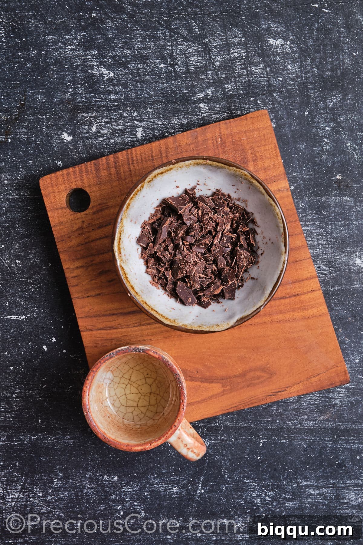 Grated chocolate in a bowl, prepared for melting to make frosting.