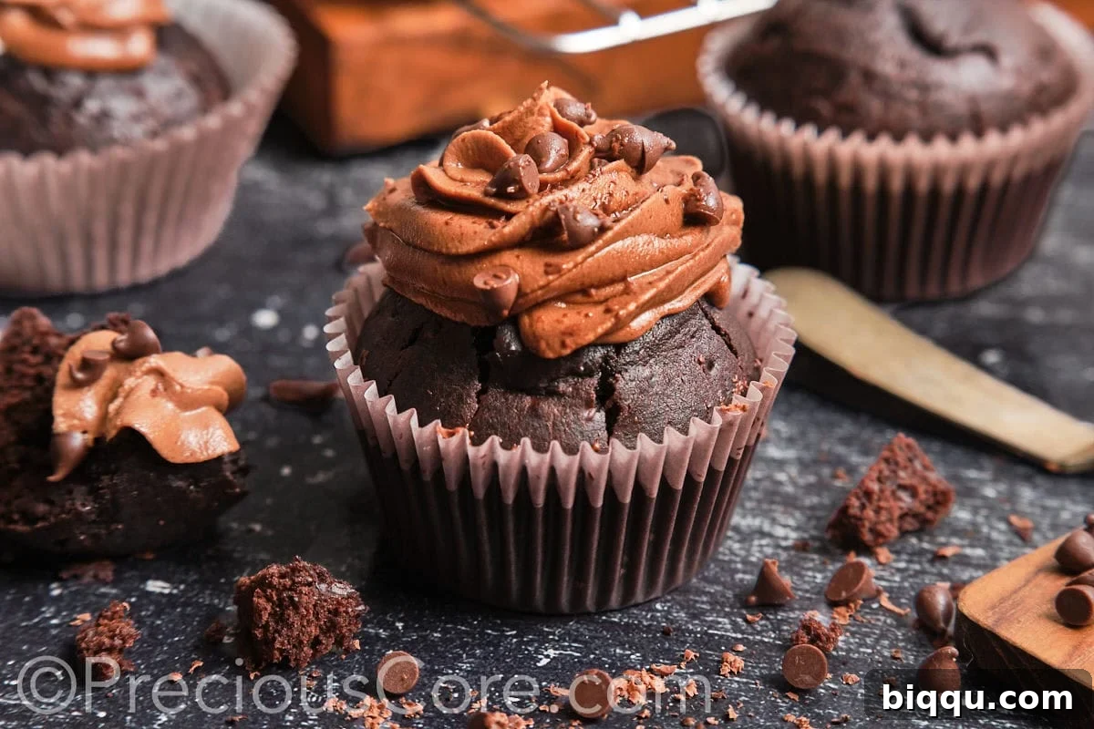 Landscape view of a freshly baked, moist chocolate cupcake ready for frosting.