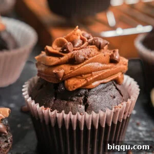 Zoom-in on a chocolate cupcake with chocolate frosting.
