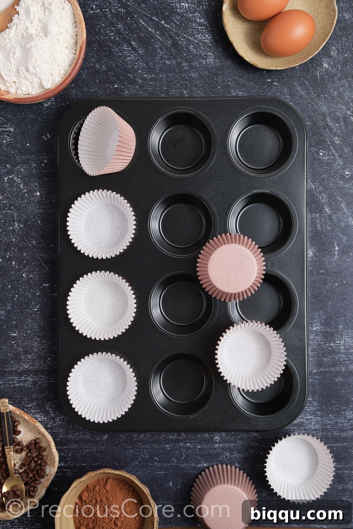 A muffin pan neatly lined with brown cupcake liners, ready for batter.