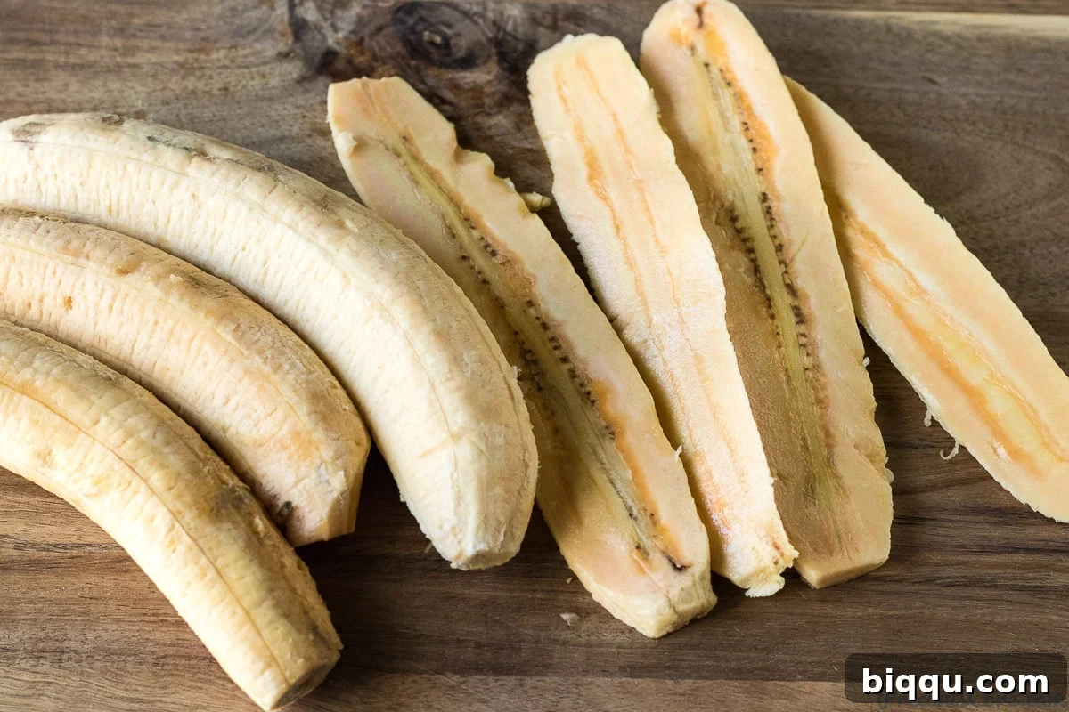 SlicIng plantains lengthwise.
