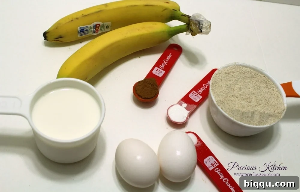 Ingredients for making whole wheat banana pancakes, including bananas, flour, eggs, and milk