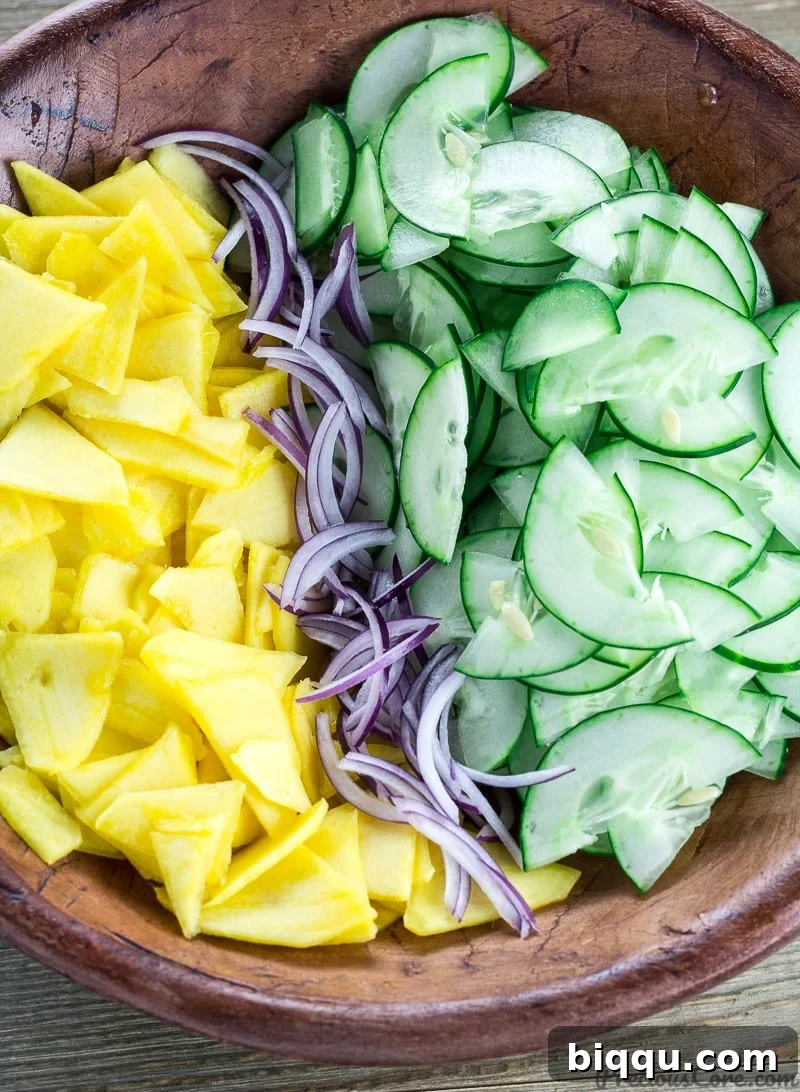 Refreshing Cucumber Mango Salad 3 Cucumber Mango Salad in a bowl, ready to be served
