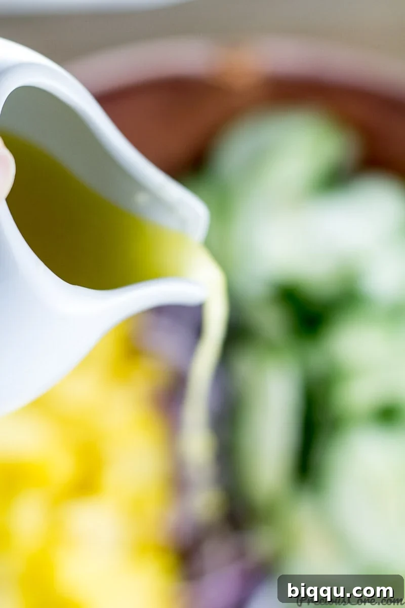 Refreshing Cucumber Mango Salad 5 Bowl of homemade dressing for cucumber mango salad