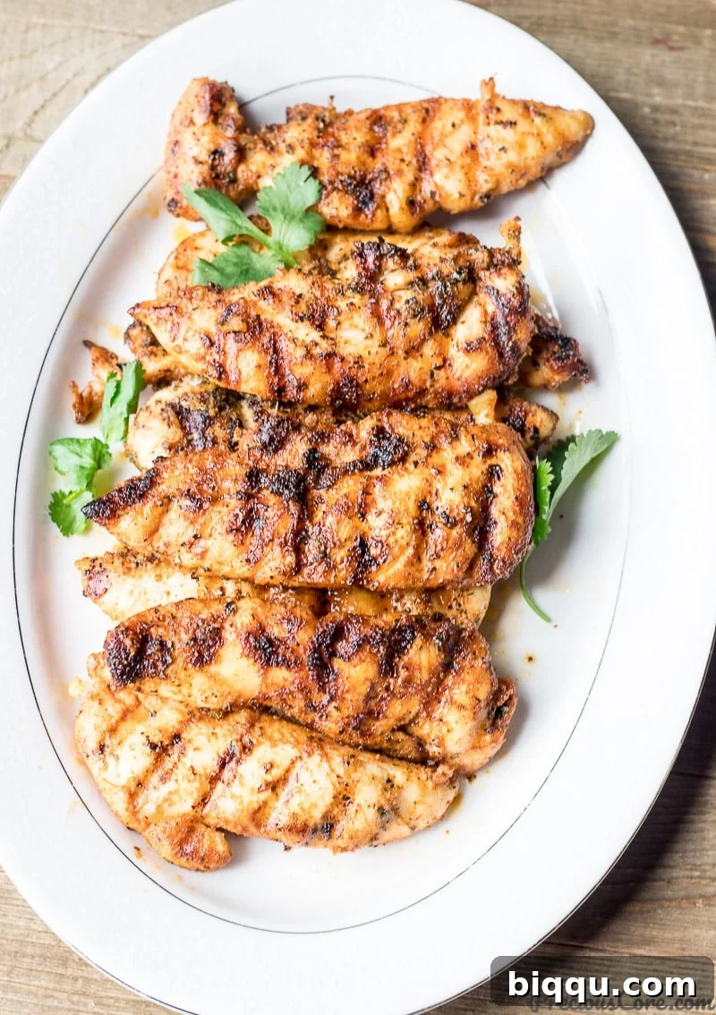 Delicious grilled chicken tenders served with fries, ready to eat