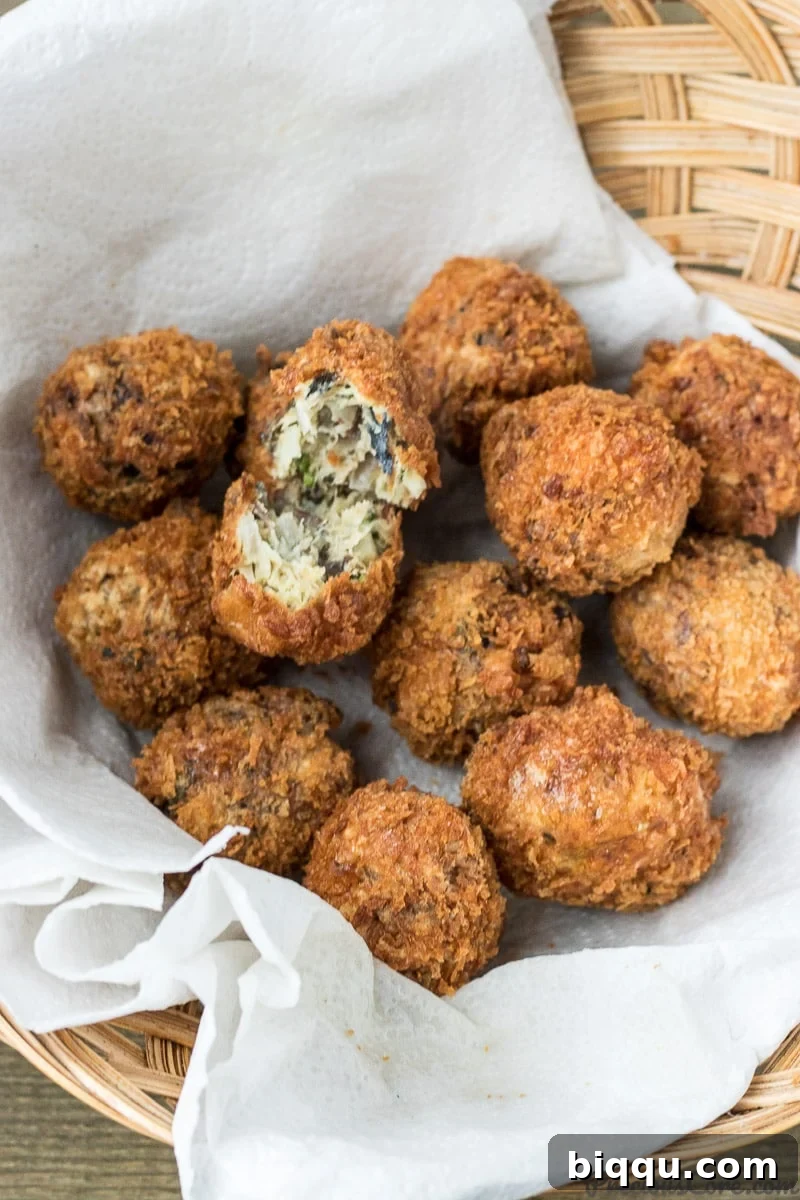 Golden-brown, crispy African Fish Balls on a platter