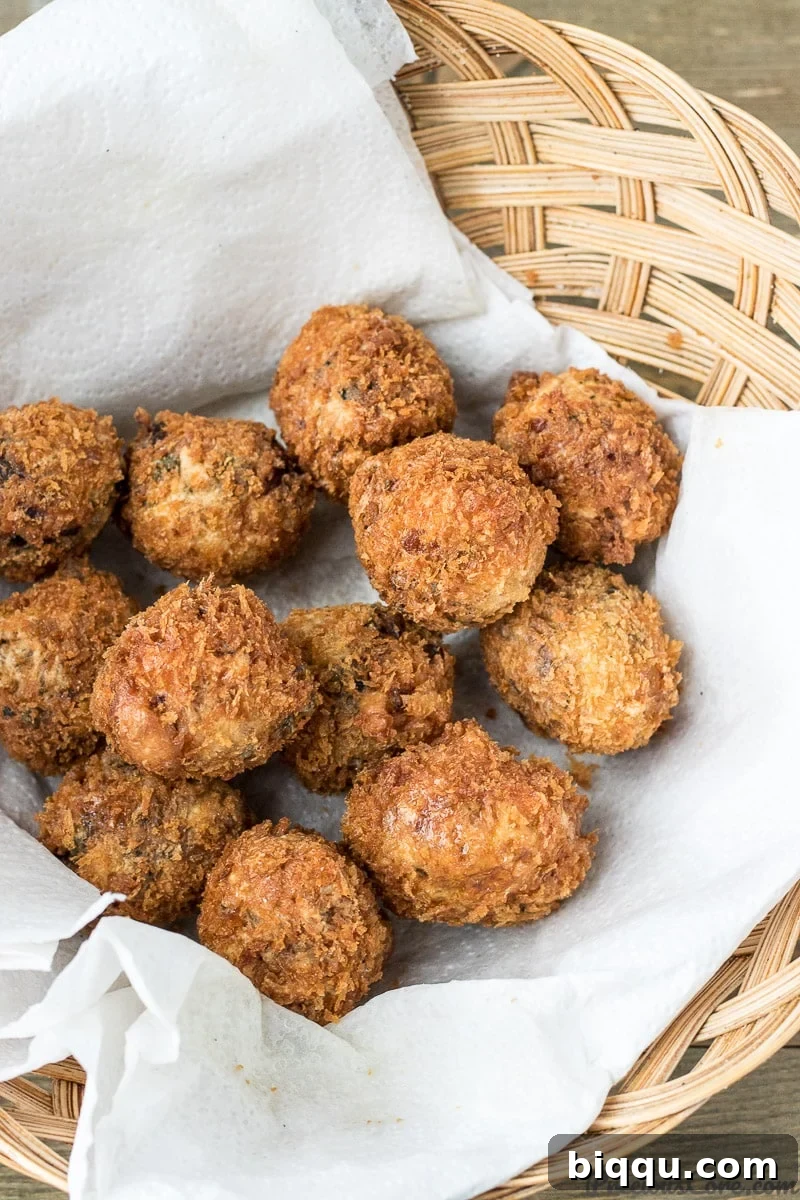 Fried African Fish Balls, golden and crispy, on a serving platter