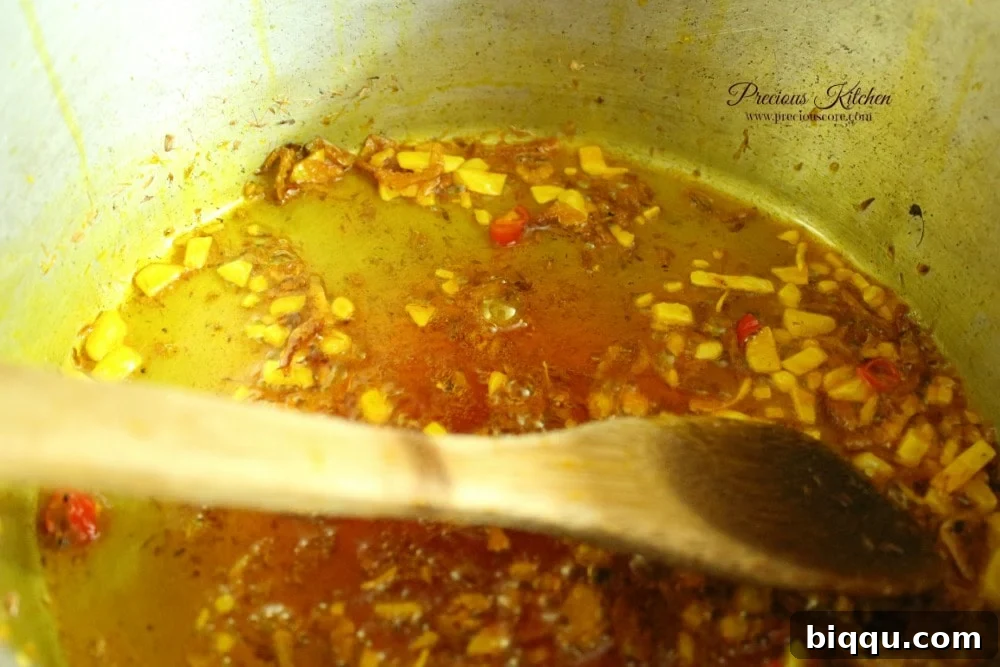 Crayfish, chopped pepper, and Maggi added to sautéed onions in palm oil