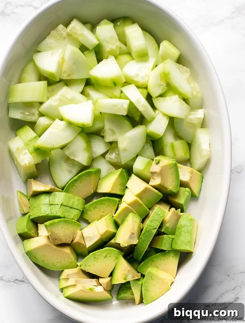 Chopped Cucumber Avocado Salad ingredients in a bowl